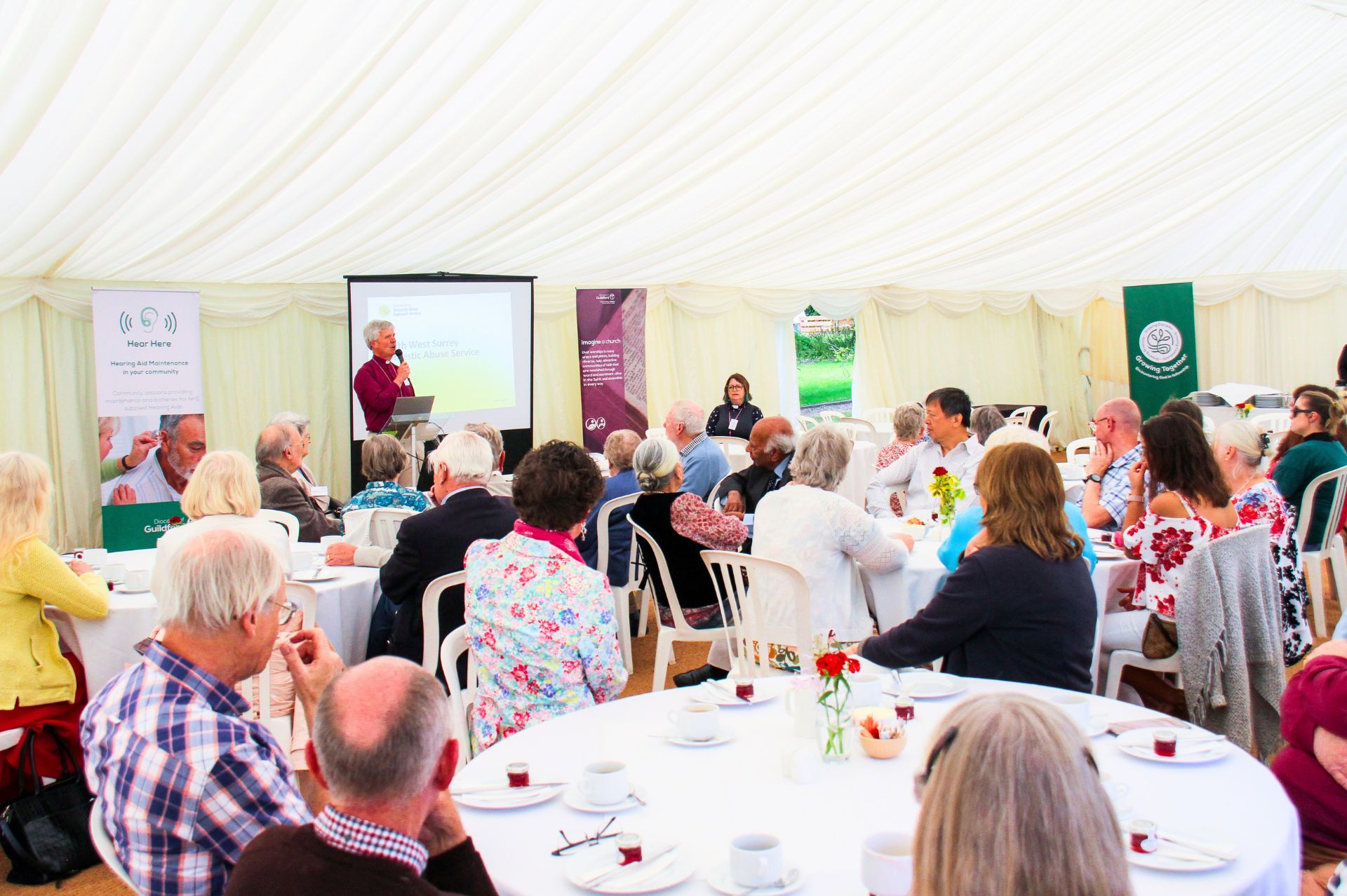 Bishop Andrew Watson addresses the attendees of the Hear Here Tent Week event