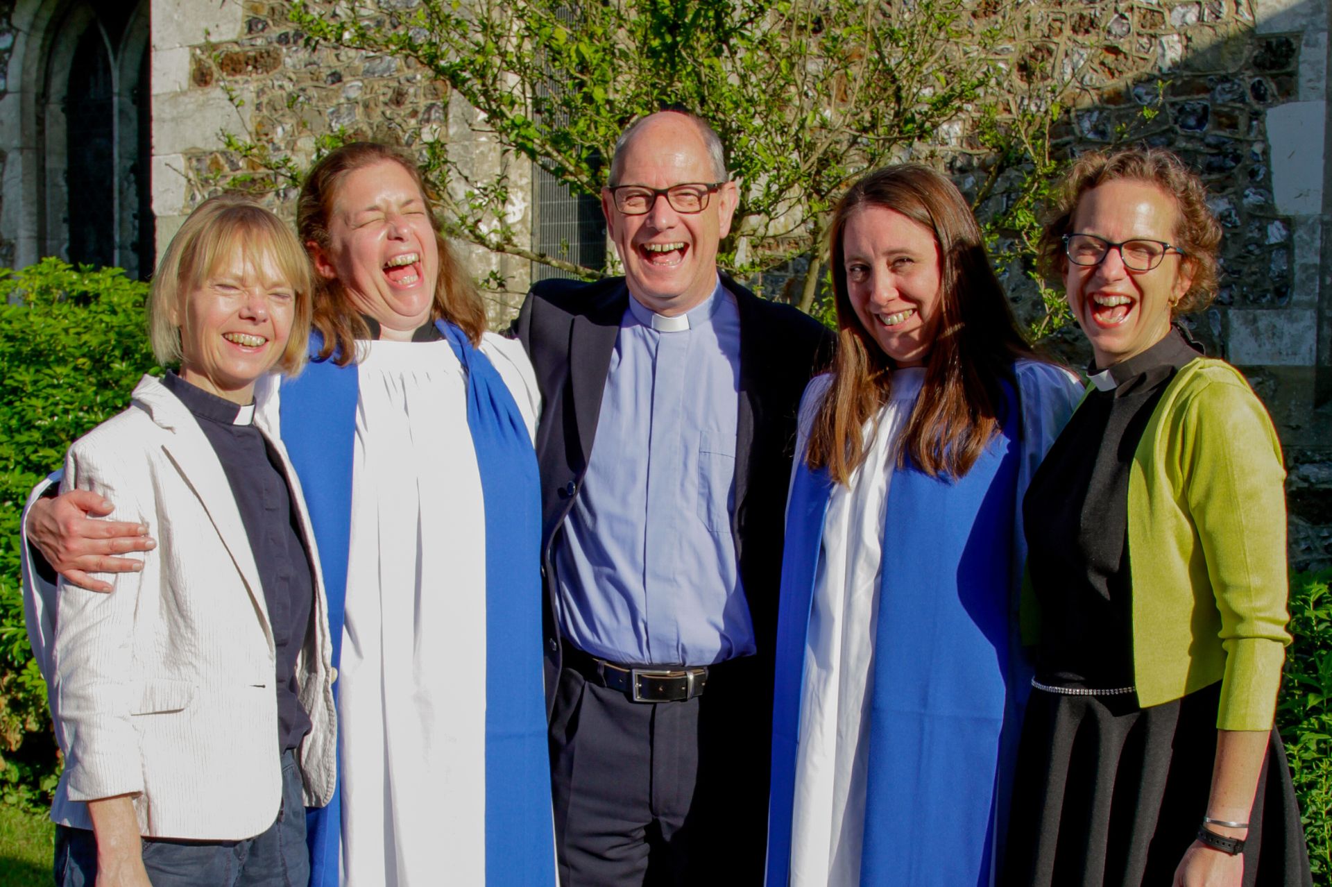 Sam Fisk and Amber Wood stood celebrating with tutors from the LMP