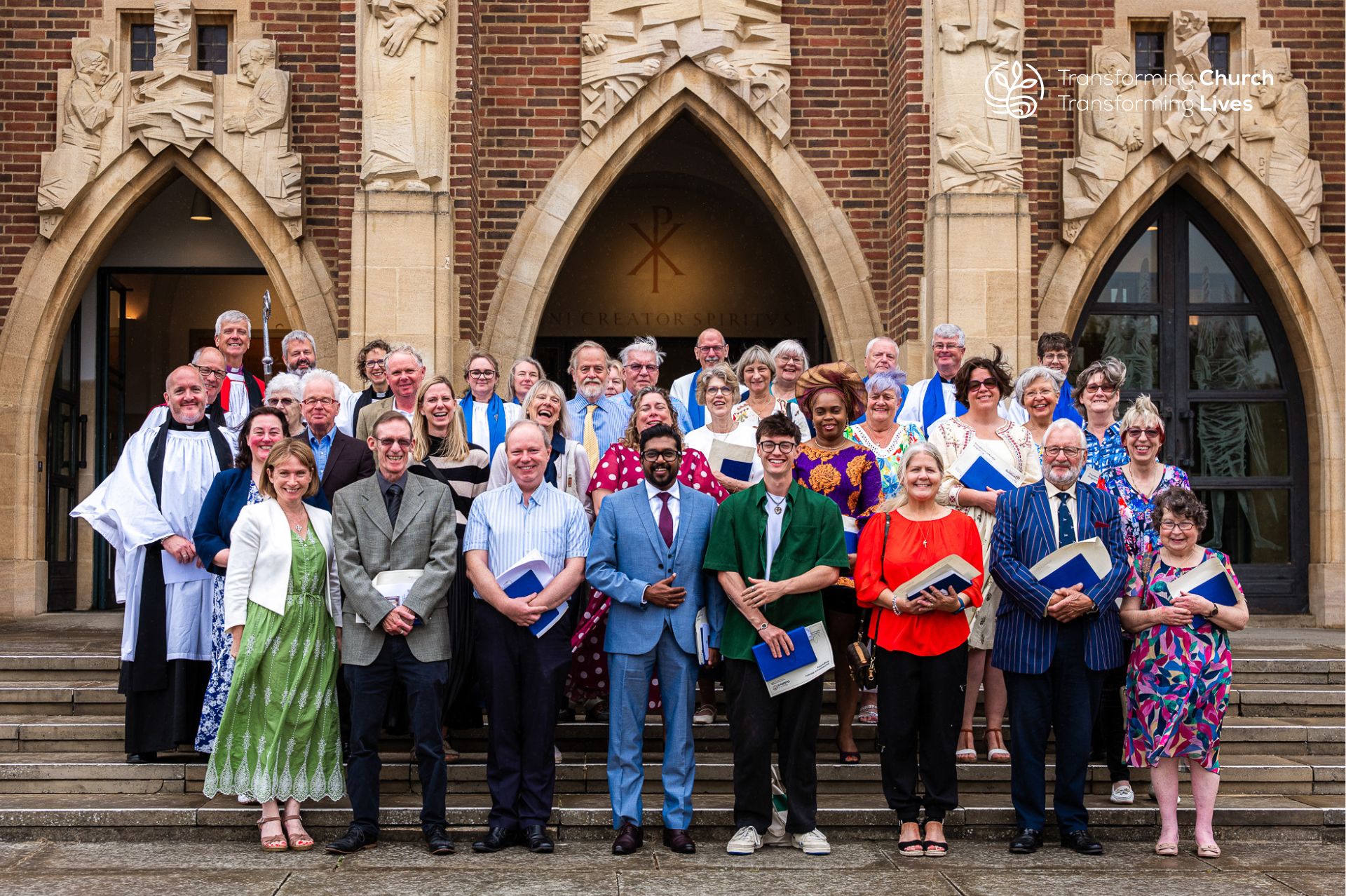 All the Licensed Lay Minsters and Lay Associate Ministers pose for a photo with Bishop Andrew and their tutors on the steps outside Guildford Cathedral