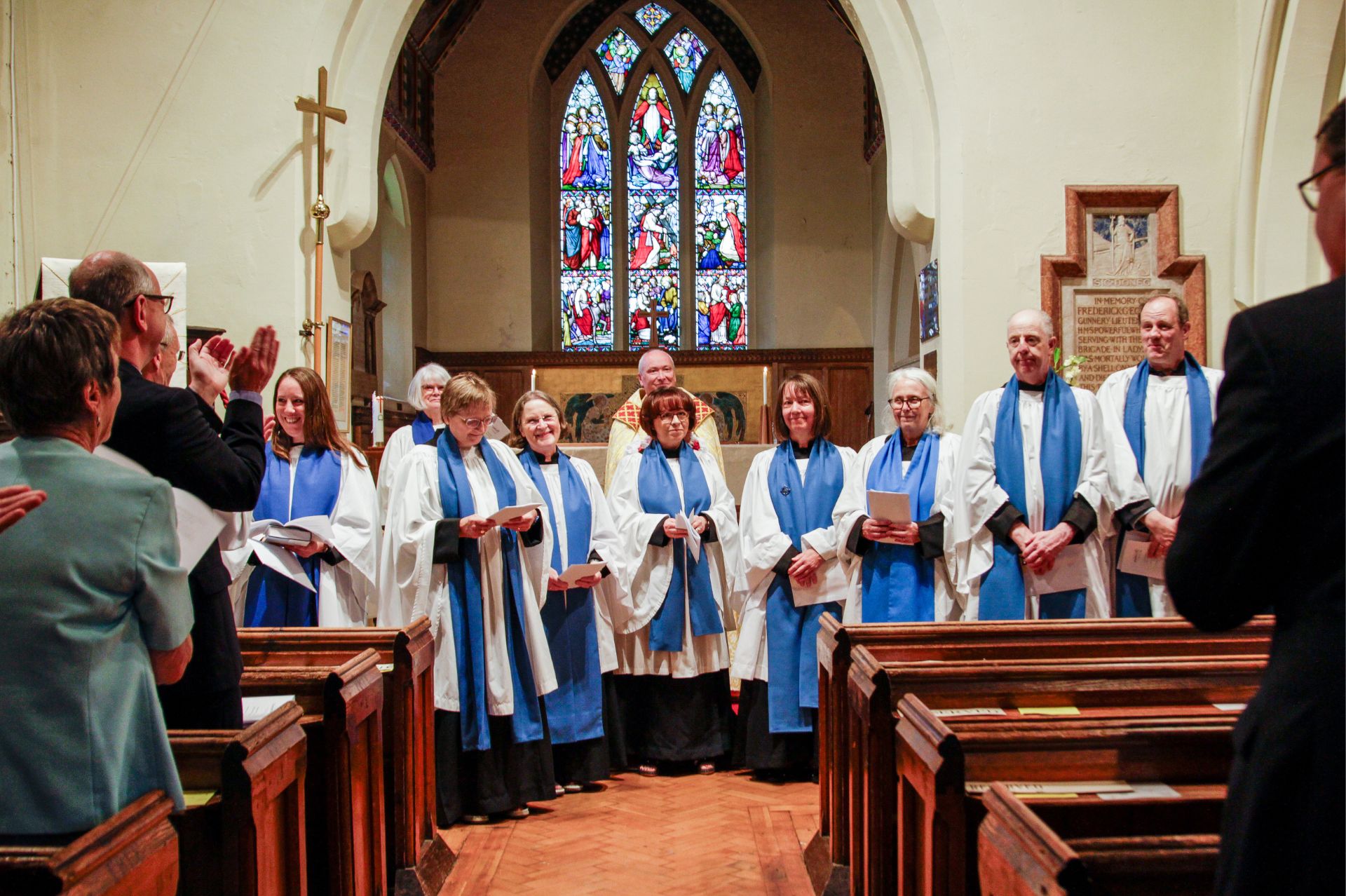 The licensed LLMs stood at the front of the church being applauded