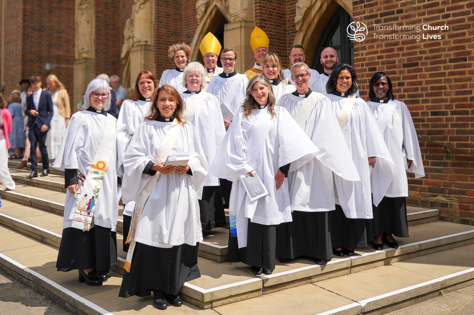 Deacons in full clerical attire celebrate their ordination with Bishop Andrew and Bishop Paul
