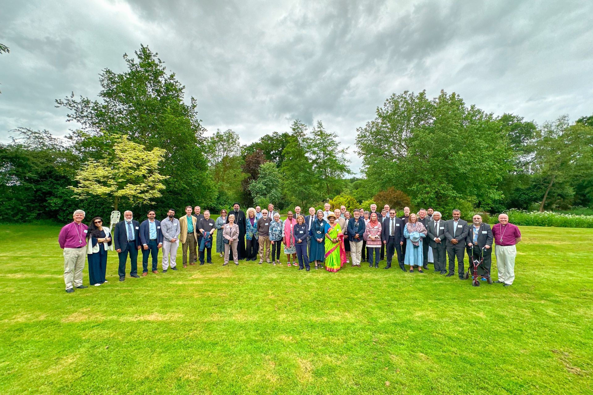 Interfaith leaders pose for a photo in Willow Grange gardens